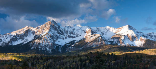 Mount Sneffels is within the Uncompahgre National Forest. An early fall snowstorm covers the peaks. stock photo