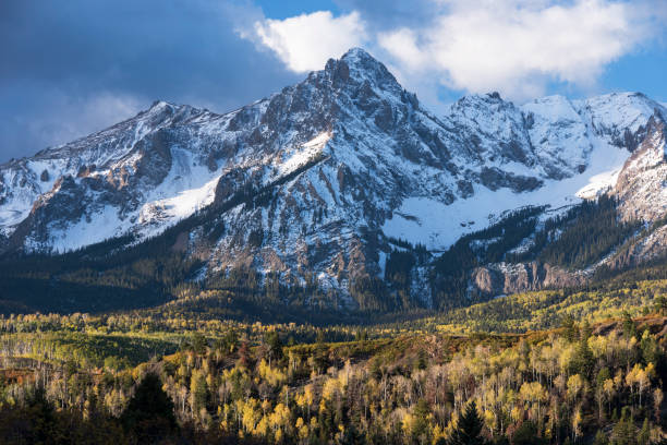 istock Mount Sneffels is within the Uncompahgre National Forest. An early fall snowstorm covers the peaks. 1132323658
