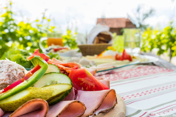 istock Brettljause, cold plate with meal on wooden table in vineyard 1132323738