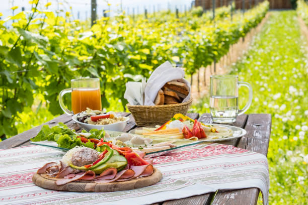 istock Brettljause, cold plate with meal on wooden table in vineyard 1132323744