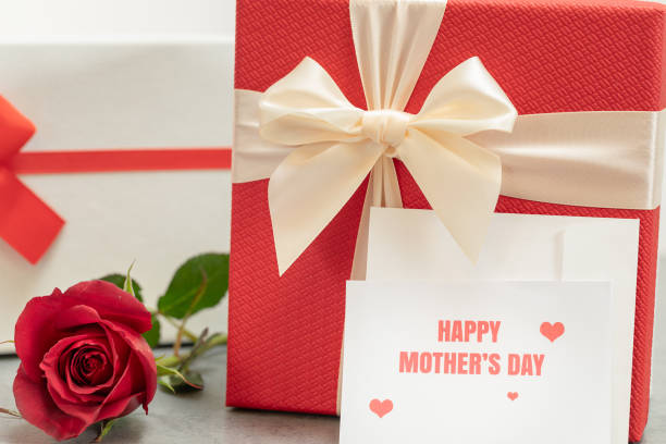 istock Happy Mother's Day Message With Gift Boxes and Red Rose 1132324081