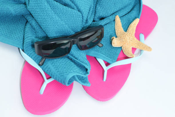 istock Beach towel with bath slippers 1132327877