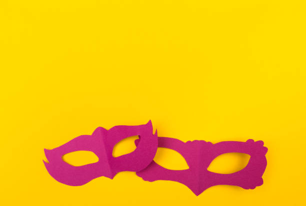 istock cut out colored paper figures for the holiday Mardi Gras, colour background 1132327949