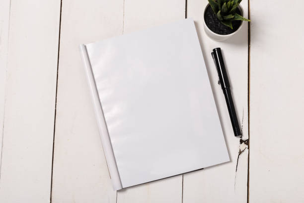 istock Mock-up magazine or catalog on wooden table. Blank page or notepad on wood background. Blank page or notepad for mockups or simulations 1132328238