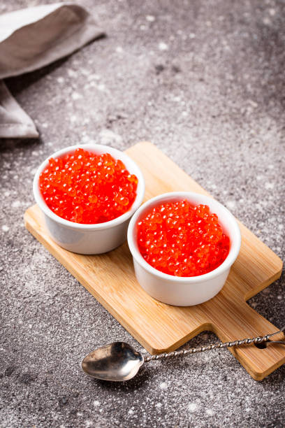 istock Two bowls with red salmon caviar 1132328270