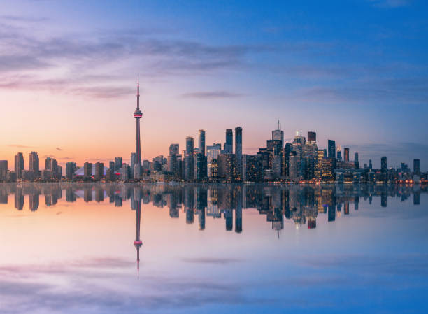 Toronto Skyline at sunset with reflection - Toronto, Ontario, Canada Toronto Skyline at sunset with reflection - Toronto, Ontario, Canada ontario canada stock pictures, royalty-free photos & images