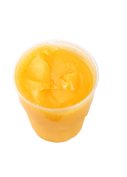 istock yellow honey in plastic figured container isolated on white background at dry sunny day 1132328725