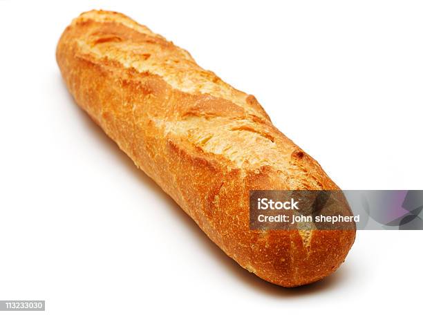 Foto de Palito De Pão Francês Recémassado Isolado Contra Branco e mais fotos de stock de Baguete
