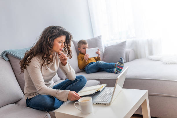 istock Boy and mother using tablet and laptop. 1132330723