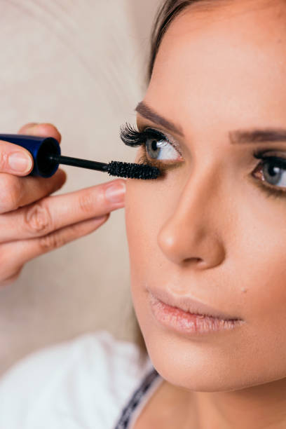 istock Make up artist putting mascara on eyelashes 1132331719