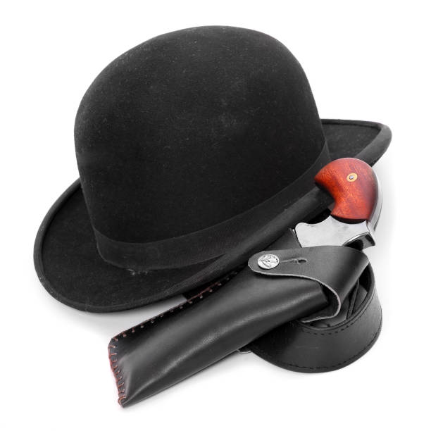 istock Bowler hat with handgun and other old-fashioned detective accessory. 1132332203