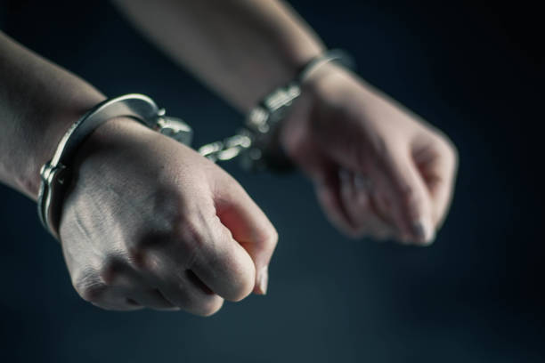 istock women handcuffed in criminal concept 1132332436