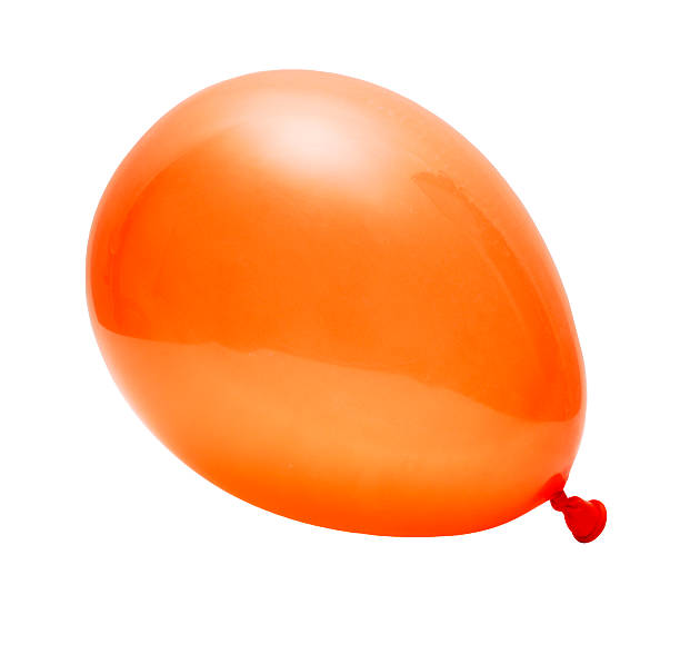 orange inflated party balloon isolated against white stock photo