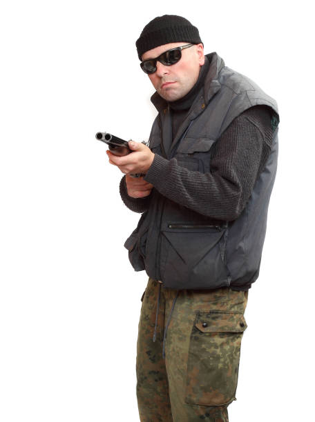 istock Dangerous gangster or terrorist with shotgun. 1132333060