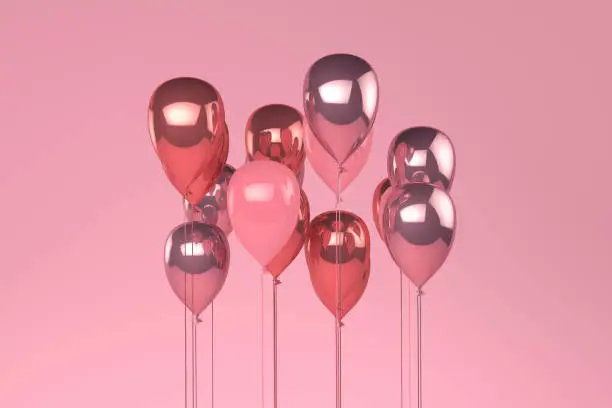 Photo of Balloons on pastel pink background.