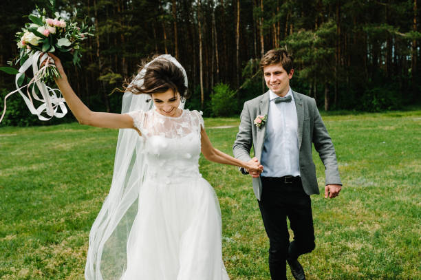 istock Happy bride and groom getting married in the green forest. Wedding ceremony. 1132333424