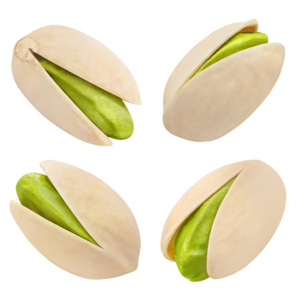 pistachios auf weiß - nut cracked roasted food stock-fotos und bilder