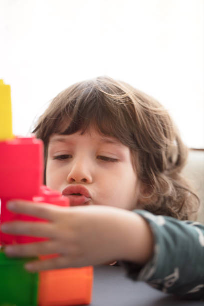 istock Happy child playing with Preschoolers Building Blocks 1132336720