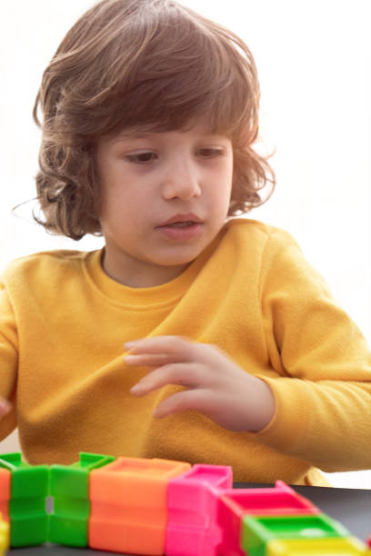 istock Happy child playing with Preschoolers Building Blocks 1132336930