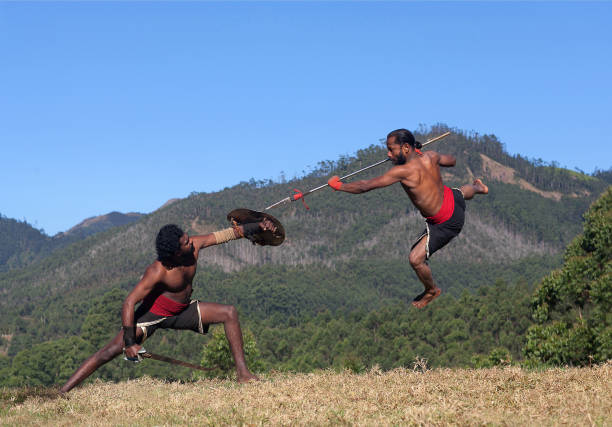 kalaripayattu martial art in kerala, india - east asian ethnicity foto e immagini stock