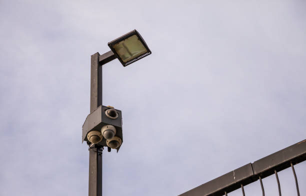 istock Security cameras and lights isolated against the sky 1132339837