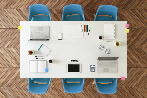 istock Top view at large team office desk 1132340219