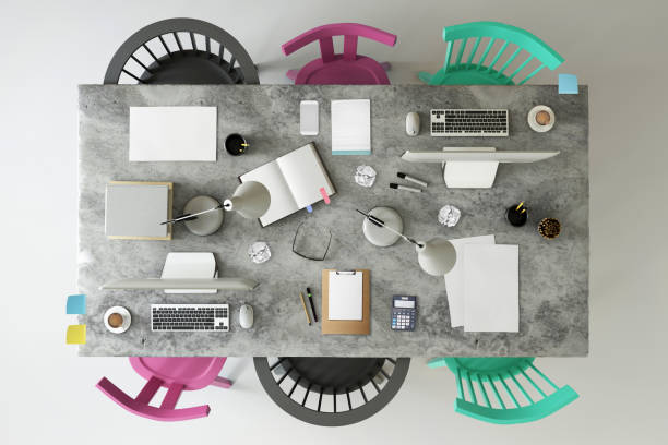 istock Top view at large team office desk 1132340330