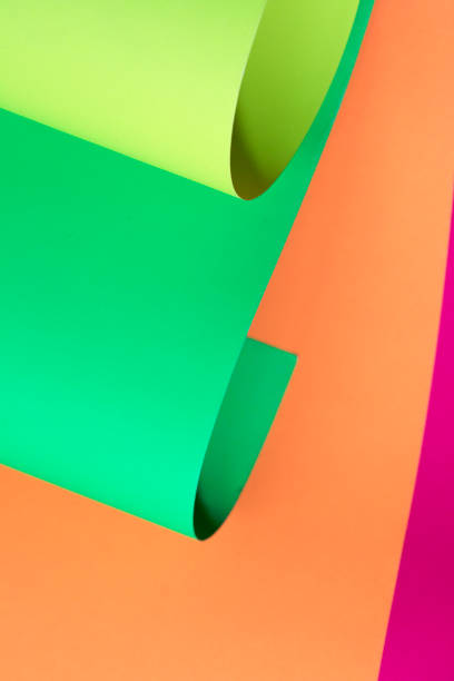istock Neon pink,green and yellow Curled paper background. 1132342856