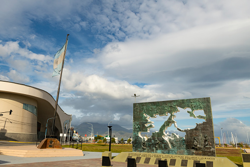 Ushuaia, Argentina - January 12, 2019: Image of the Malvinas War National Historical Monument (Falklands War) and the casino in the city center of Ushuaia in Argentina