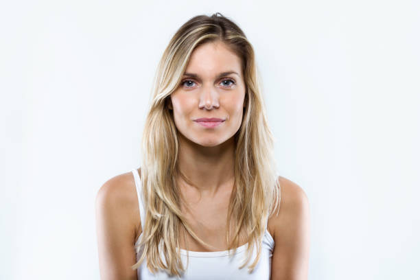 istock Confident young happy woman looking at camera over white background. 1132343275