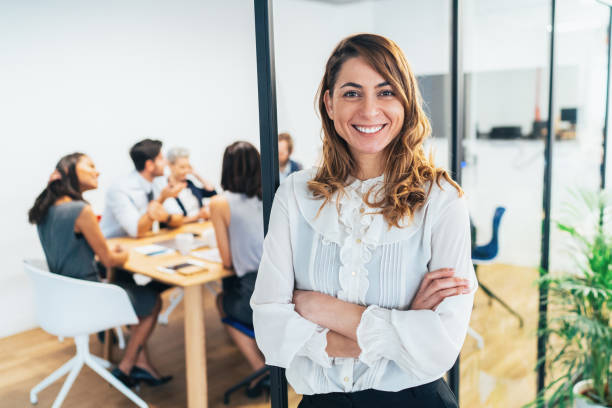 istock Business woman with his team behind 1132345141