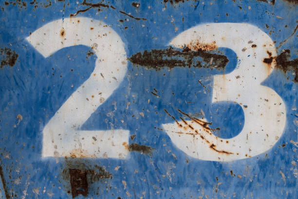 istock number twenty three painted on rusty blue metal 1132345457