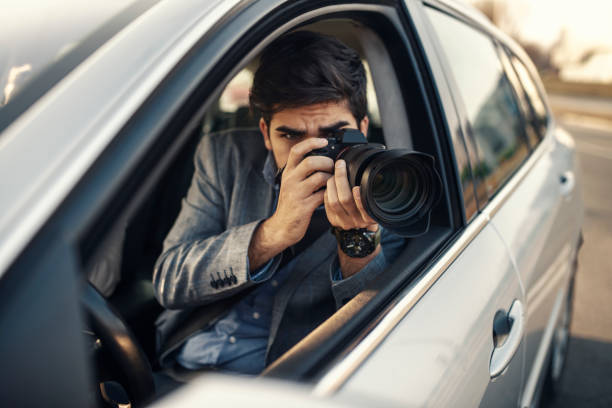 istock Close-up - Young Man Photorapher Sitting In The Car 1132345465