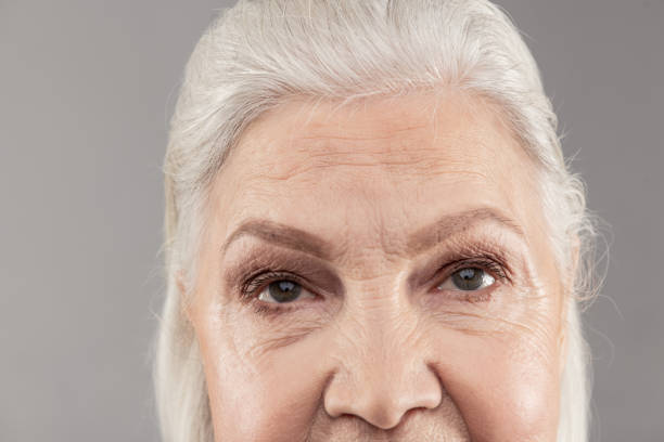 istock Senior grey-haired lady showing higher part of her face 1132347028