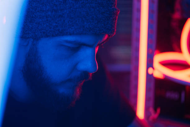 istock Hacking and criminal concept.A hacker in a secret hiding place is neon light. 1132347093
