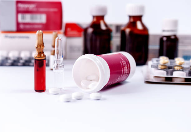istock Ampoules and medical preparations on white table 1132348356
