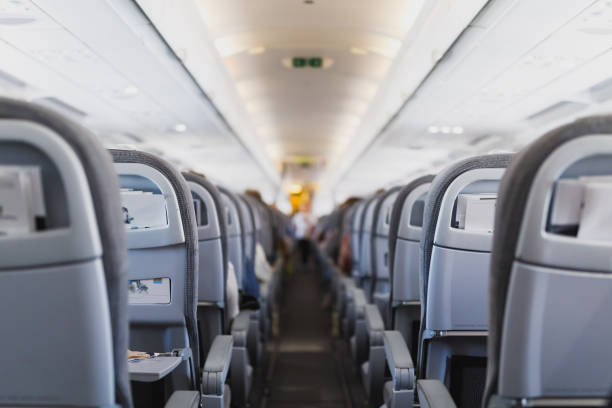 istock airline passenger seats and aisle 1132348585