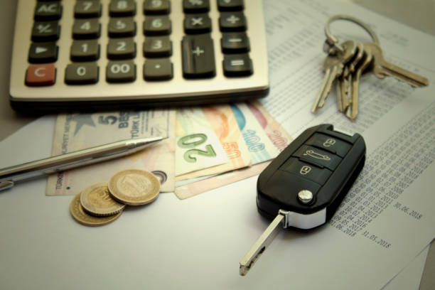 Car and house key, calculator with money on the table Car and house key, calculator with money on the table counting instrument stock pictures, royalty-free photos & images