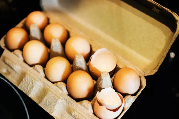Closeup of chicken eggs in paper box