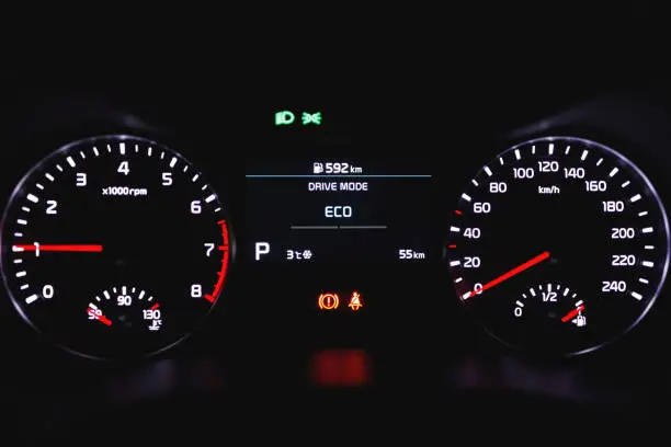 Photo of speedometer dashboard with illumination