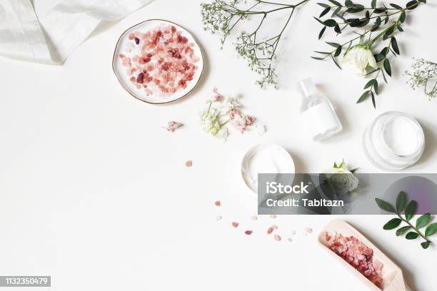Styled Beauty Corner Web Banner Skin Cream Tonicum Bottle Dry Flowers Leaves Rose And Himalayan Salt White Table Background Organic Cosmetics Spa Concept Empty Space Flat Lay Top View Stock Photo - Download Image Now