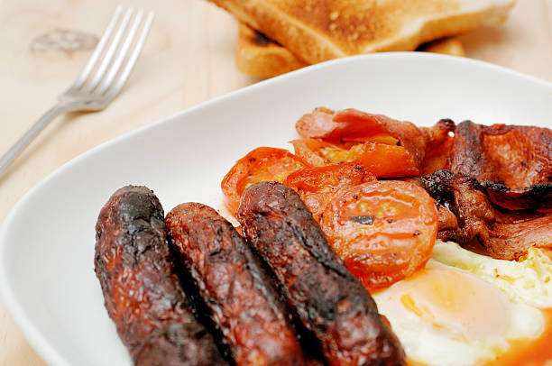istock Full English breakfast, greasy fry up background 113235260