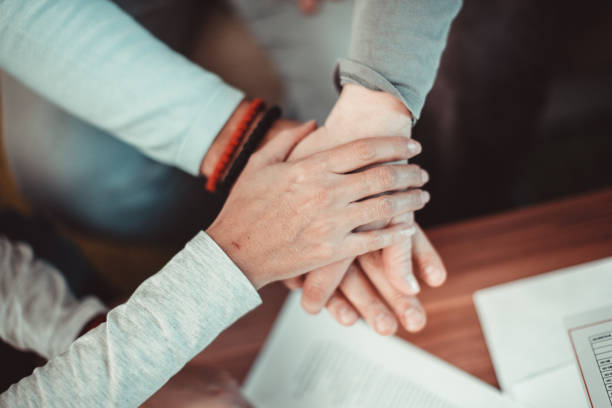 istock Business people showing unity - holding hands 1132352837
