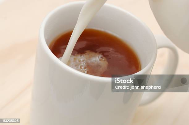 Mug Of Tea Coffee With Milk Pouring In Stock Photo - Download Image Now - British Culture, Color Image, Cultures
