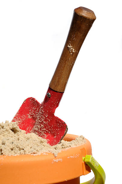 istock bucket and spade filled with sand isolated against white 113235380