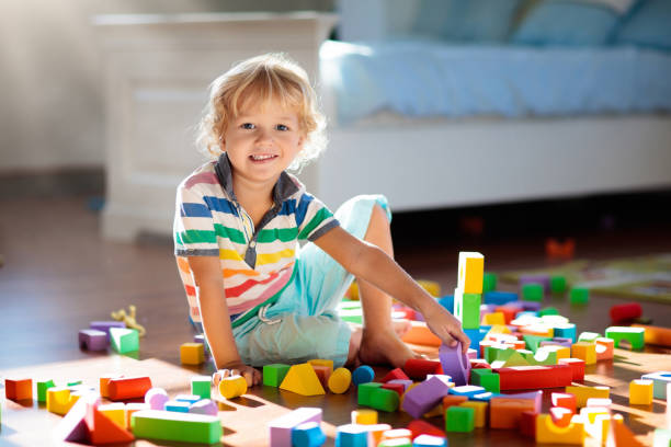 istock Child playing with colorful toy blocks. Kids play. 1132355779