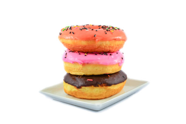 istock Delicious donuts Colorful on white plate isolated on white background 1132356121