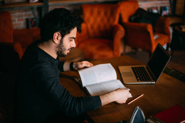 istock Young Student Preparing for Exam in Cafe 1132356374