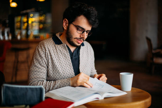 istock Young Student Preparing for Exam in Cafe 1132356380