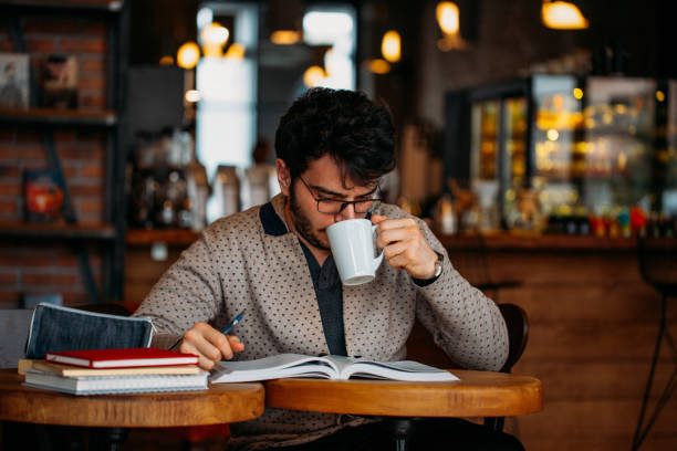istock Young Student Preparing for Exam in Cafe 1132356383